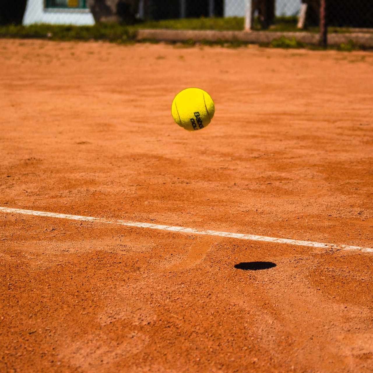 tennis ball bouncing on ground