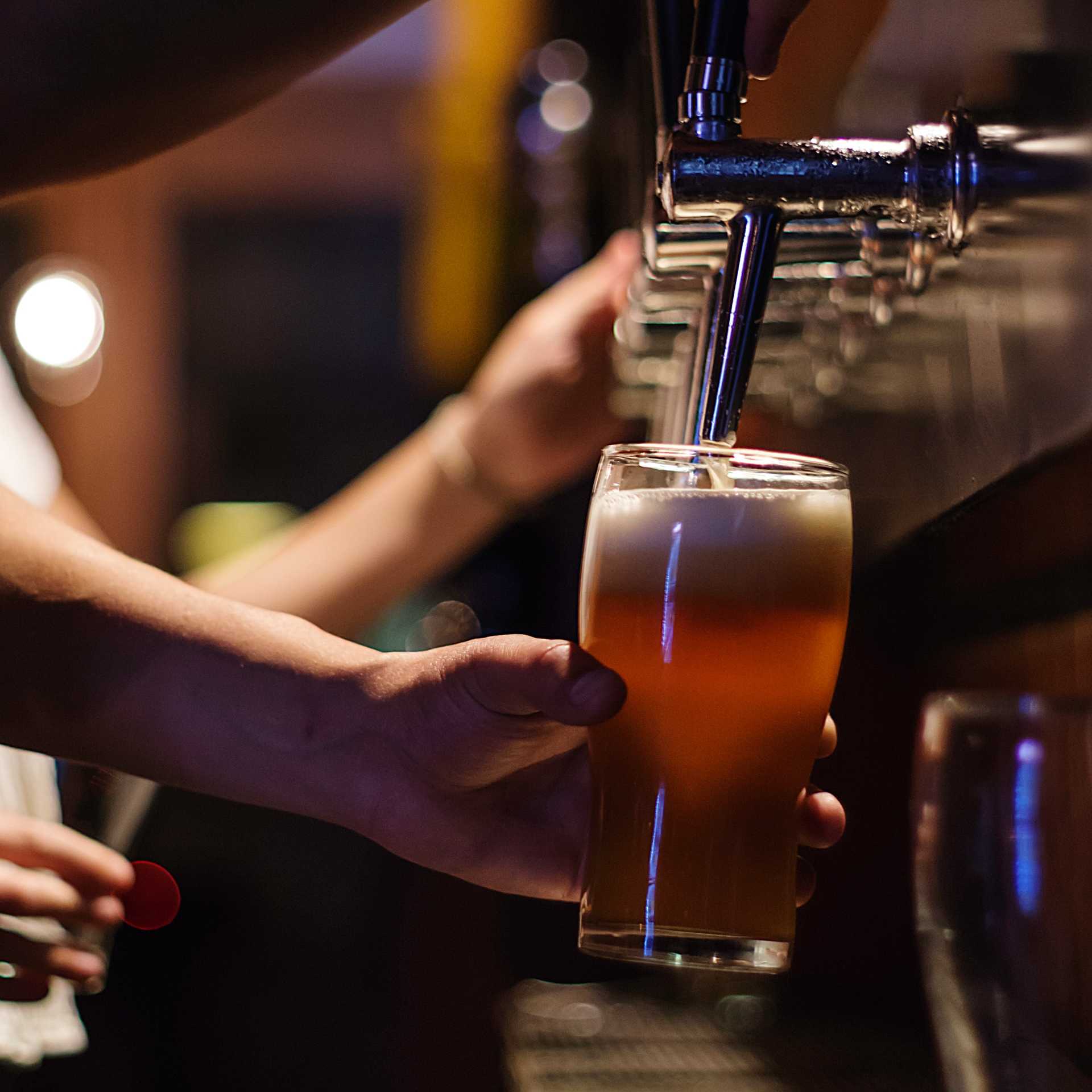 person holding drinking glass